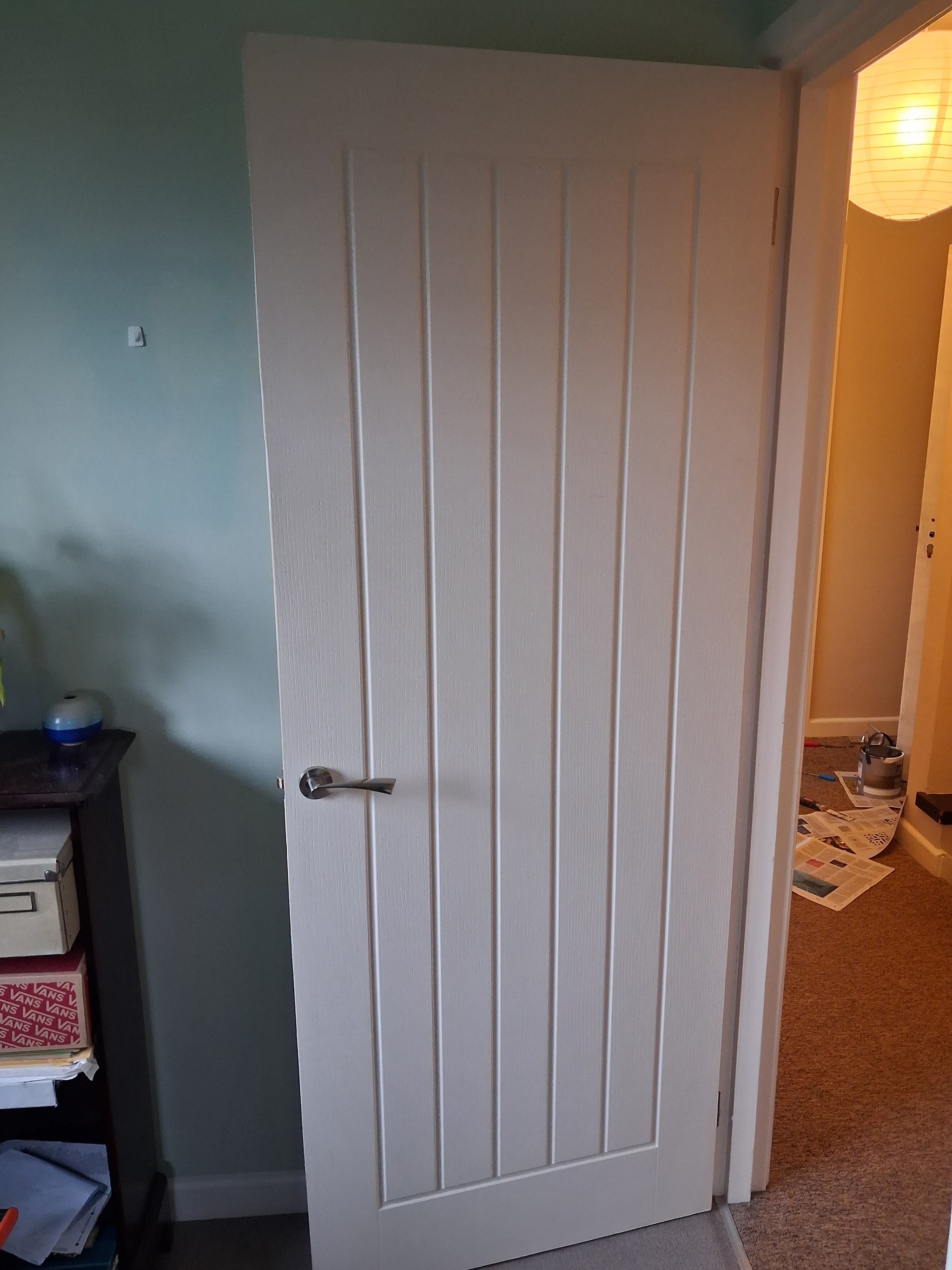Newly hung white panelled internal door