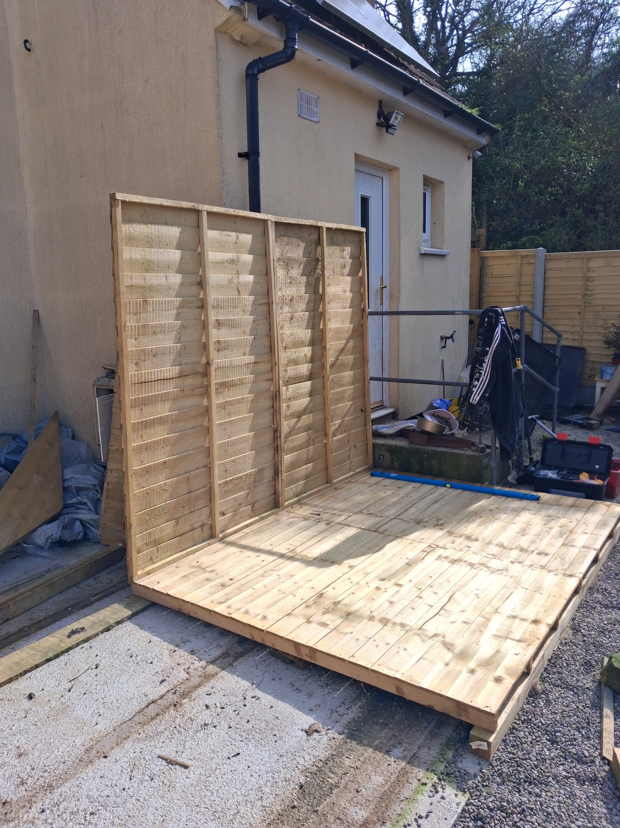 Timber deck base and new fence panels in a back garden